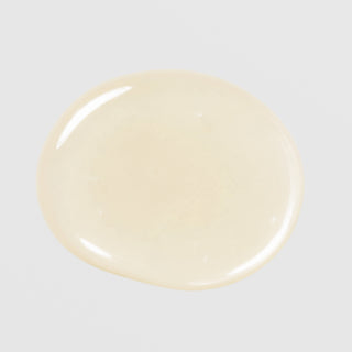 Le Mieux Vita-C Serum texture swatch showing lightweight pale yellow vitamin C serum formula on grey background.