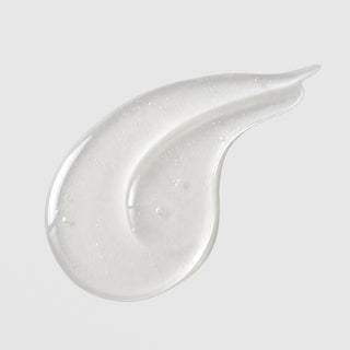 Michele Corley Hydrating Cleansing Gel texture swatch showing lightweight clear gel cleanser formula with fine bubbles on grey background.