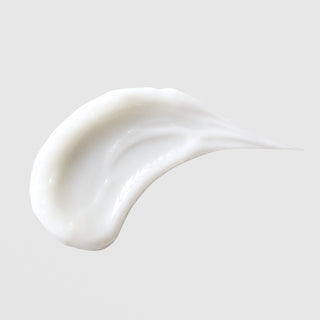 Michele Corley Purifying Oxygen Lotion texture swatch showing lightweight glossy white lotion formula on grey background.