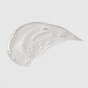 Michele Corley Ultimate Hydration Gel texture swatch showing lightweight clear gel formula with air bubbles on grey background.
