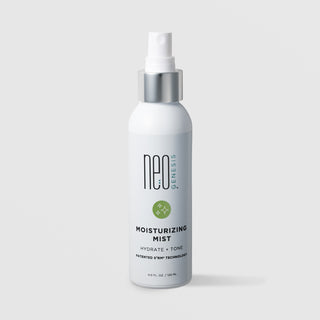 NeoGenesis Moisturizing Mist Hydrate and Tone 120 mL in a tall white fine mist spray bottle with chrome silver collar and sage green sparkle icon label on a light gray background