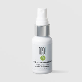 NeoGenesis Moisturizing Mist Hydrate and Tone 30 mL in a white fine mist spray bottle with chrome silver collar and sage green sparkle icon label on a light gray background
