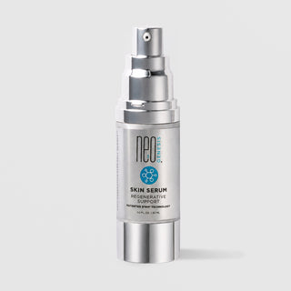 NeoGenesis Skin Serum Regenerative Support 30 mL in a full chrome silver airless pump bottle with teal molecular icon label on a light gray background
