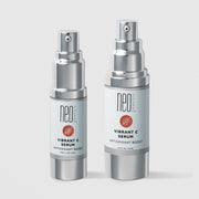 NeoGenesis Vibrant C Serum Antioxidant Boost in two sizes: 15 mL and 30 mL, shown side by side in full chrome silver airless pump bottles with light gray labels and terracotta botanical leaf icons on a light gray background