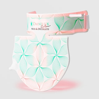 Omnilux Contour Neck & Décolleté LED device in two pieces — a curved neck band and a shield-shaped chest panel — both featuring a white and teal floral line pattern with pink LED glow along the bottom edge, displayed against a light gray background.