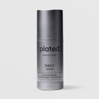 Plated Skin Science DAILY Serum in silver cylindrical airless pump bottle with cap on, featuring Renewosome technology for daily skin renewal and anti-aging