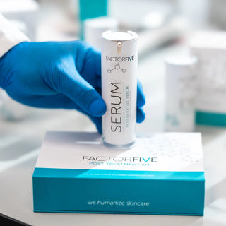 FactorFive Regenerative Serum bottle held above the brand's post treatment kit