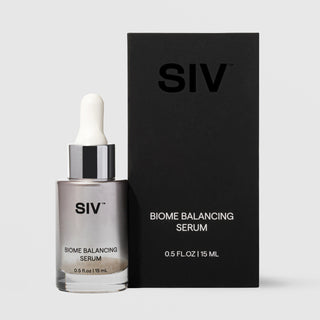 SIV Biome Balancing Serum 15mL glass dropper bottle with metallic silver finish beside its matte black box, 0.5 fl oz