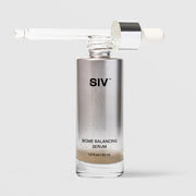 SIV Biome Balancing Serum 30mL glass bottle with dropper pipette removed and resting across the top, showing metallic silver and clear glass packaging