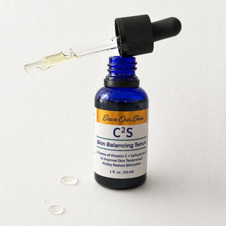 Save Our Skin C2S Skin Balancing Serum 1 oz cobalt blue dropper bottle open with serum-filled pipette resting across top
