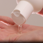 Dispensing GlyMed Plus Beta Gel with 10% Glycolic Acid from white pump bottle into palm of hand
