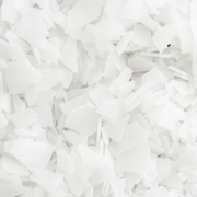 Close-up of Ancient Minerals Magnesium Bath Flakes showing white crystalline magnesium chloride flake texture