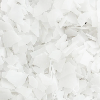 Close-up of Ancient Minerals Magnesium Bath Flakes showing white crystalline magnesium chloride flake texture
