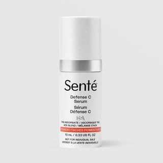 Sente Defense C Serum in a white cylindrical bottle with a silver metallic collar and black text, set against a light gray background.
