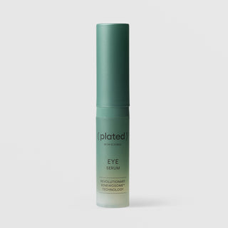 Plated Skin Science Eye Serum in teal gradient bottle with cap on, featuring Renewosome technology for dark circles, puffiness, and fine lines