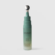Plated Skin Science Eye Serum teal bottle with cap removed, revealing precision cooling metal roller ball applicator