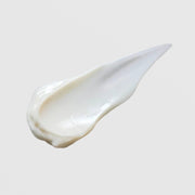 Skin Script Acai Berry Moisturizer creamy white texture swatch showing rich smooth consistency on grey background