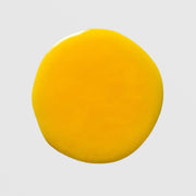 Skin Script Advanced Renewal Serum texture drop showing vibrant bright yellow serum formula on grey background.