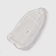 Skin Script Ageless Lip Treatment texture swatch showing clear translucent gel with smooth glossy consistency and subtle iridescent shimmer. Available at Art of Skin Care