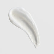 Skin Script Ageless Skin Moisturizer texture swatch showing rich glossy white anti-aging cream formula on grey background.