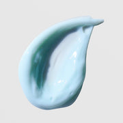Skin Script Botanical Bloom Hydrating Mask texture swatch showing swirled light blue and teal cream formula on grey background.