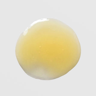 Skin Script Peptide Eye Serum texture swatch showing smooth warm golden yellow gel with lightweight fluid consistency. Available at Art of Skin Care
