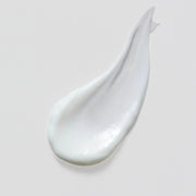 Skin Script Peptide Moisturizer texture swatch showing smooth glossy white cream formula on grey background.