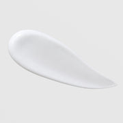 Skin Script Pomegranate Antioxidant Cleanser texture swatch showing smooth white creamy cleanser formula on grey background.