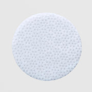 Skin Script Clarifying Toner Pads round white textured exfoliating pad with dotted surface for gentle exfoliation and effective product delivery. Available at Art of Skin Care.