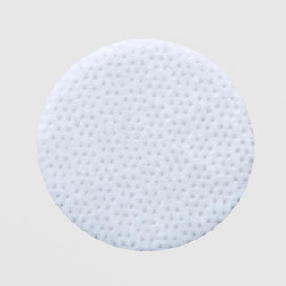 Skin Script Clarifying Toner Pads round white textured exfoliating pad with dotted surface for gentle exfoliation and effective product delivery. Available at Art of Skin Care.