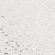 Skin Script Cucumber Hydration Toner texture close-up showing ultra-fine clear water droplets on white surface.
