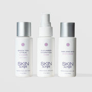 Skin Script Everyday Balance Travel Kit featuring three 2oz bottles: Green Tea Citrus Cleanser, Cucumber Hydration Toner, and Ageless Skin Moisturizer on light gray background