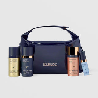 SkinBetter Science Best of Better Set with four travel-size serums and navy bag