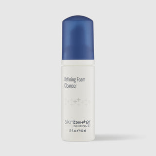 A bottle of skinbetter Science Refining Foam Cleanser with a white body and a metallic blue cap, set against a light gray background.