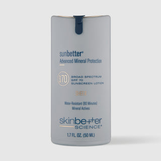 A gray bottle of Skinbetter Science sunbetter mineral sheer SPF 70 sunscreen lotion on a grey background