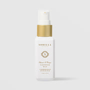Sorella Apothecary Apricot and Mango Cleansing Milk 2 oz in a white pump bottle with gold collar on a light gray background
