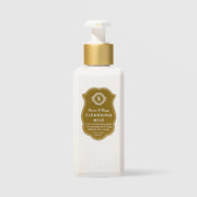 Sorella Apothecary Apricot and Mango Cleansing Milk 5.7 oz in a white pump bottle with gold shield label on a light gray background