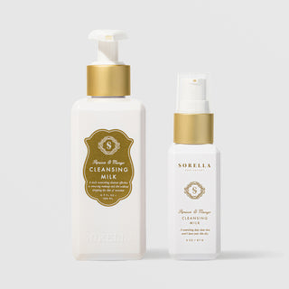 Sorella Apothecary Apricot and Mango Cleansing Milk shown in both 5.7 oz and 2 oz pump bottle sizes on a light gray background