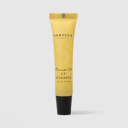 Sorella Apothecary Avocado Oil Lip Hydrator 0.25 oz in a yellow tube with black cap on a light gray background