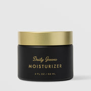 Sorella Apothecary Daily Greens Moisturizer 2 fl oz in a matte black jar with gold lid on a light gray background