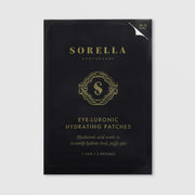 Sorella Apothecary Eye-Luronic Hydrating Patches single packet in black and gold foil packaging, 1 pair per packet, on a light gray background