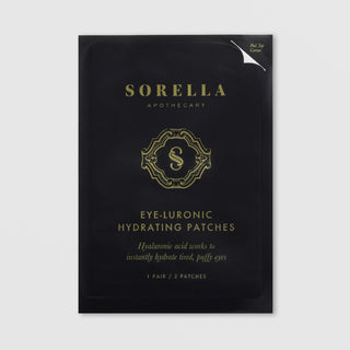 Sorella Apothecary Eye-Luronic Hydrating Patches single packet in black and gold foil packaging, 1 pair per packet, on a light gray background