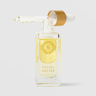 Sorella Apothecary Facial Nectar 0.9 fl oz in a clear glass dropper bottle with gold label and open dropper on a light gray background
