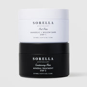 Sorella Apothecary Mandelic + Willow Bark Peel Pads two-step set with white Step 1 jar stacked on black Step 2 Mineral Treatment jar on a light gray background
