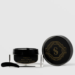 Sorella Apothecary Melt Away Cleansing Ritual 3 oz open black jar with clear base, gold label, and spatula on a light gray background