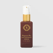 Sorella Apothecary Pomegranate Acai Antioxidant Serum (1 fl oz / 29.6 ml) in a deep burgundy pump bottle with a gold collar and white pump, featuring gold logo and lettering, displayed upright against a light gray background.