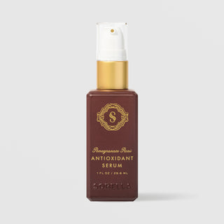 Sorella Apothecary Pomegranate Acai Antioxidant Serum (1 fl oz / 29.6 ml) in a deep burgundy pump bottle with a gold collar and white pump, featuring gold logo and lettering, displayed upright against a light gray background.