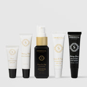 Sorella Apothecary Recovery Kit featuring five travel-size products: Lemon Lightening Serum, Blueberry Milk Moisturizer, Orange You Jelly Cleanser, Quench and Protect Hydrating SPF 30, and Salving Grace Recovery Ointment
