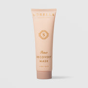 Sorella Apothecary Rehab Recovery Mask (2 oz / 57g) in a blush pink squeeze tube with gold logo and lettering, displayed upright against a light gray background