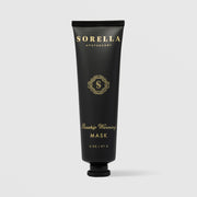 Sorella Apothecary Rosehip Warming Mask 2 oz in a matte black tube with gold label and black cap on a light gray background